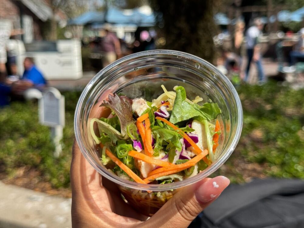 A top-down look at the vegetables topping the ramen cup.