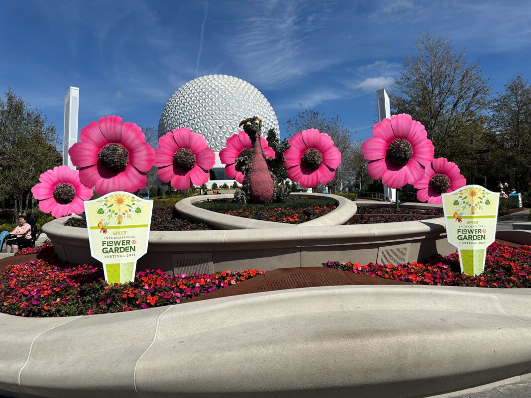 Figment and flower topiaries in World Celebration