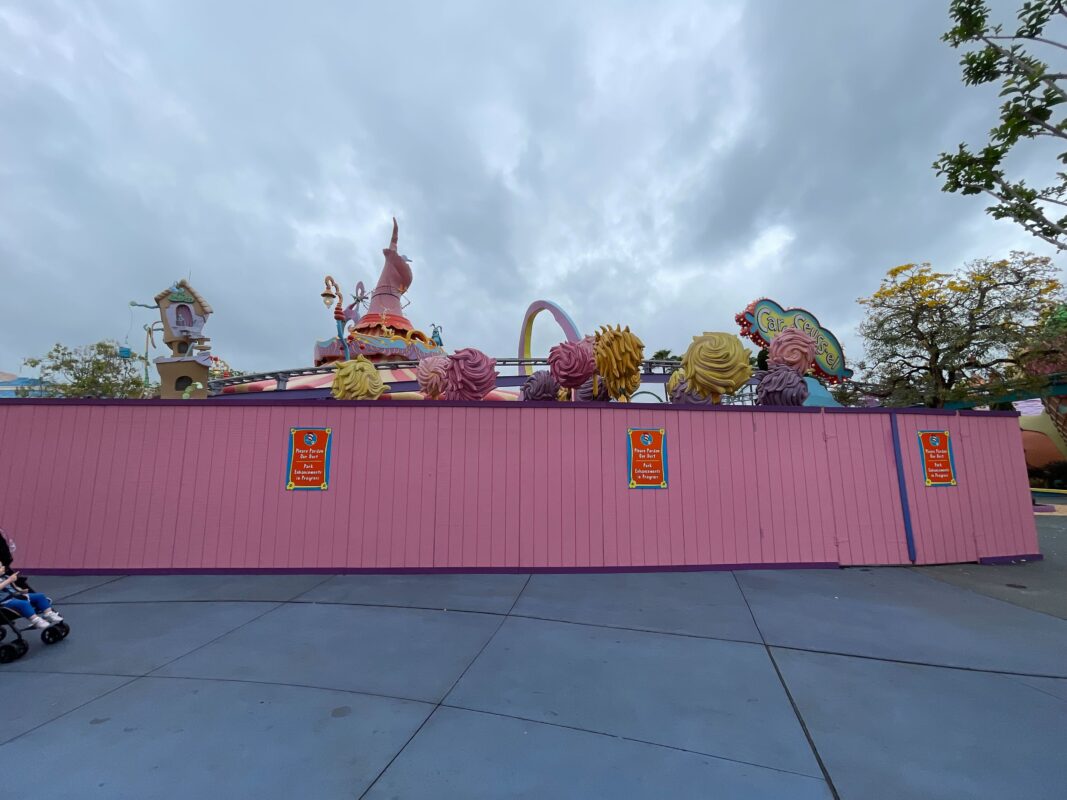 The Lorax house and Truffula trees behind construction walls