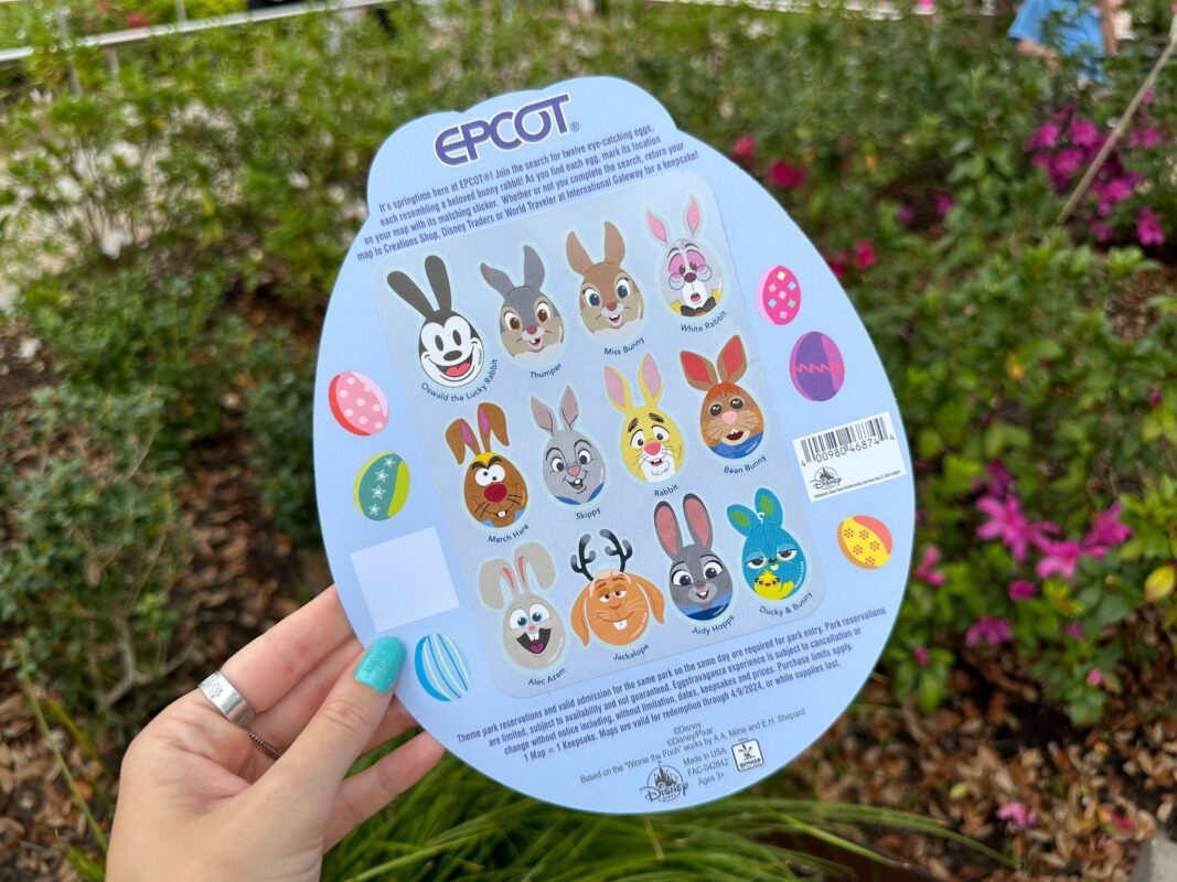 A reporter's hand holds the Eggstravaganza 2024 map, showing off the back where the stickers are kept.