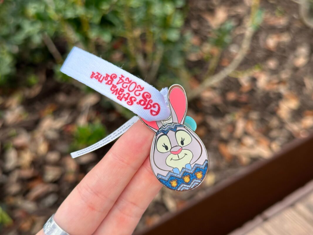 A reporter's hand holds the Judy Hopps prize charm for Eggstravaganza 2024.