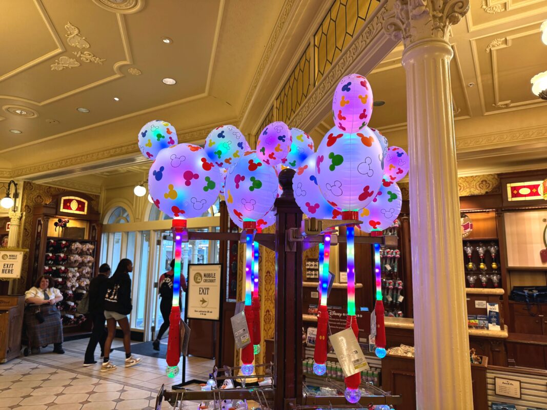 a collection of Mickey Mouse balloon wands
