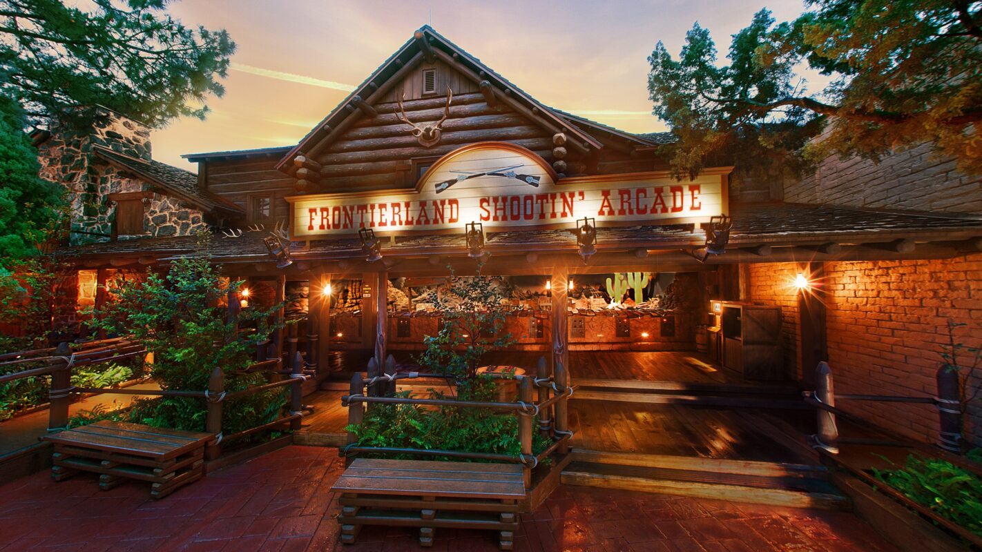 The exterior of Frontierland Shootin Arcade in Magic Kingdom at night.
