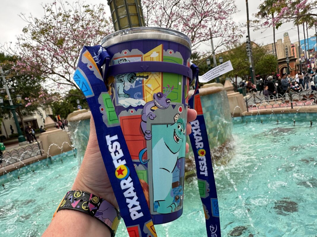 Pixar Fest 2024 "Monsters Inc." stainless steel tumbler with strap