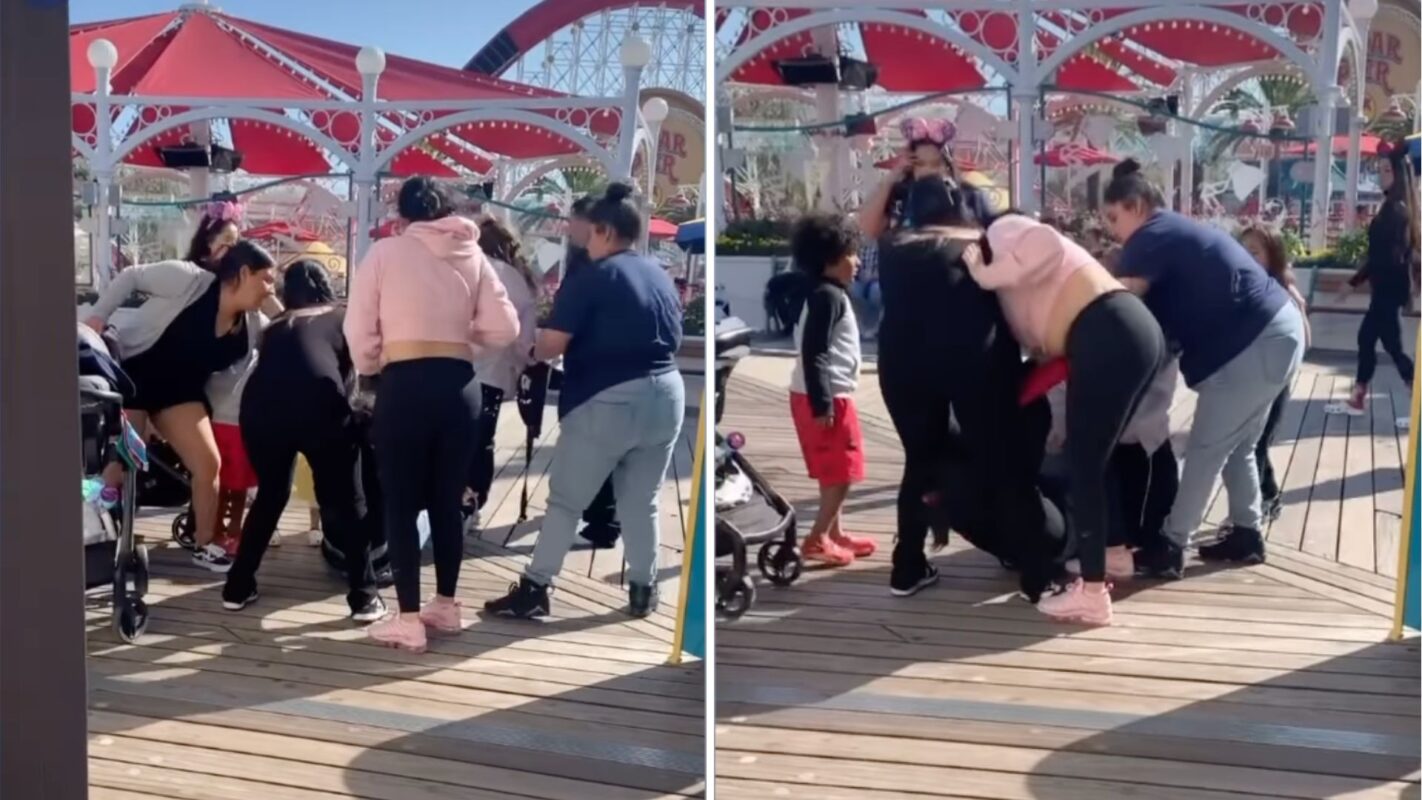 Guests fighting on Pixar Pier
