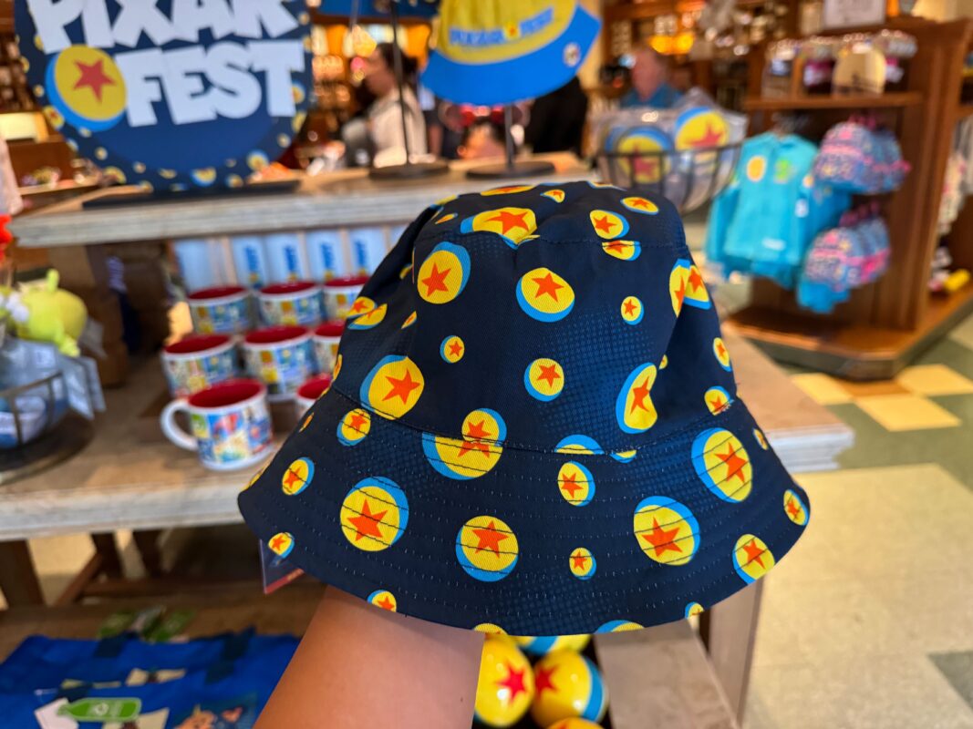 A reporter's hand showing the inside of the Pixar Fest bucket hat.