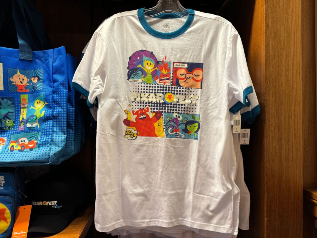 A Pixar Fest ringer T-shirt hanging on a rack.