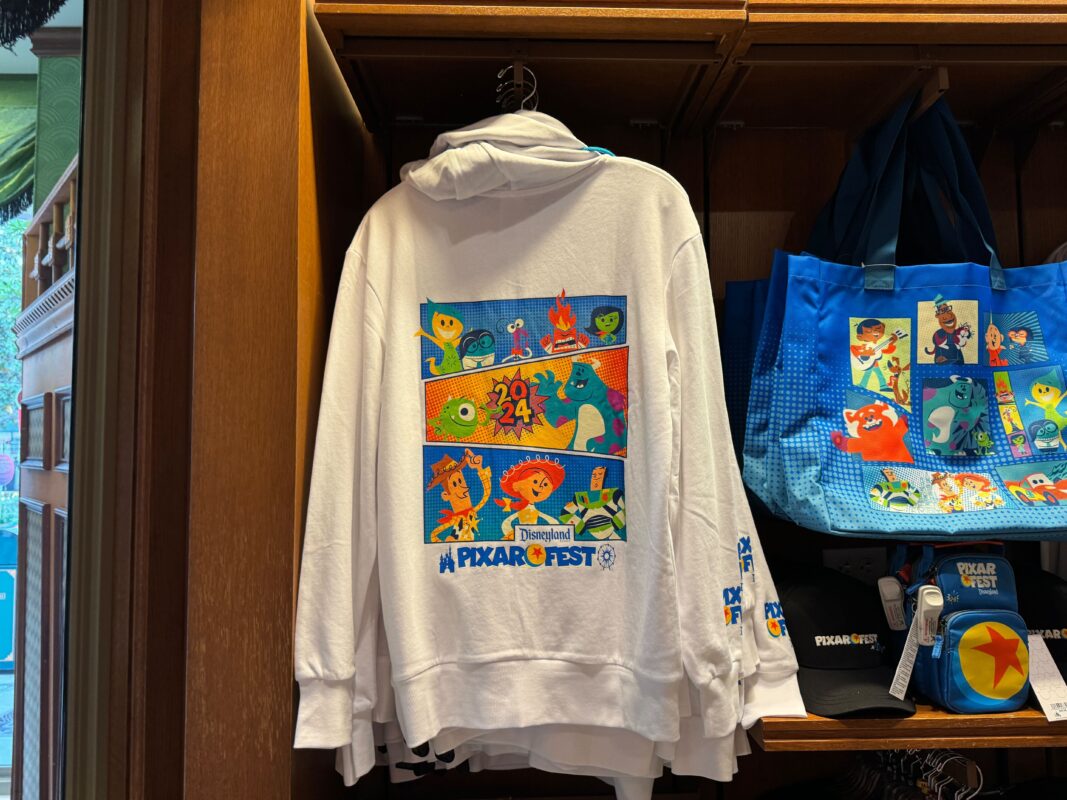 A Pixar Fest hoodie hanging on a clothing wrack.