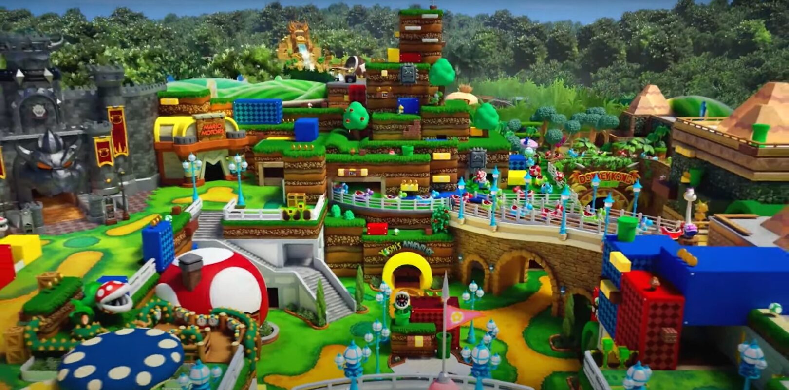 Colorful, three-dimensional mario-themed board game setup featuring iconic elements like castles, pipes, and character figures in a vivid landscape.