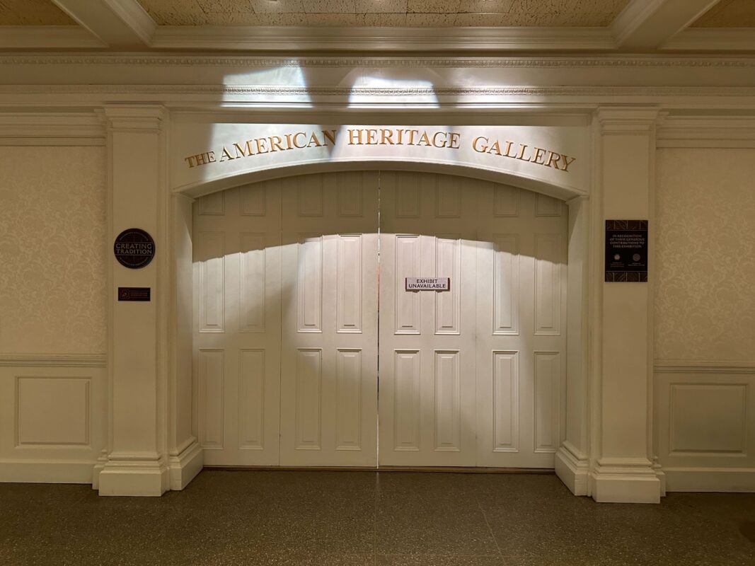 A closed doorway labeled "The American Heritage Gallery" with white double doors and a sign indicating it is temporarily unavailable.