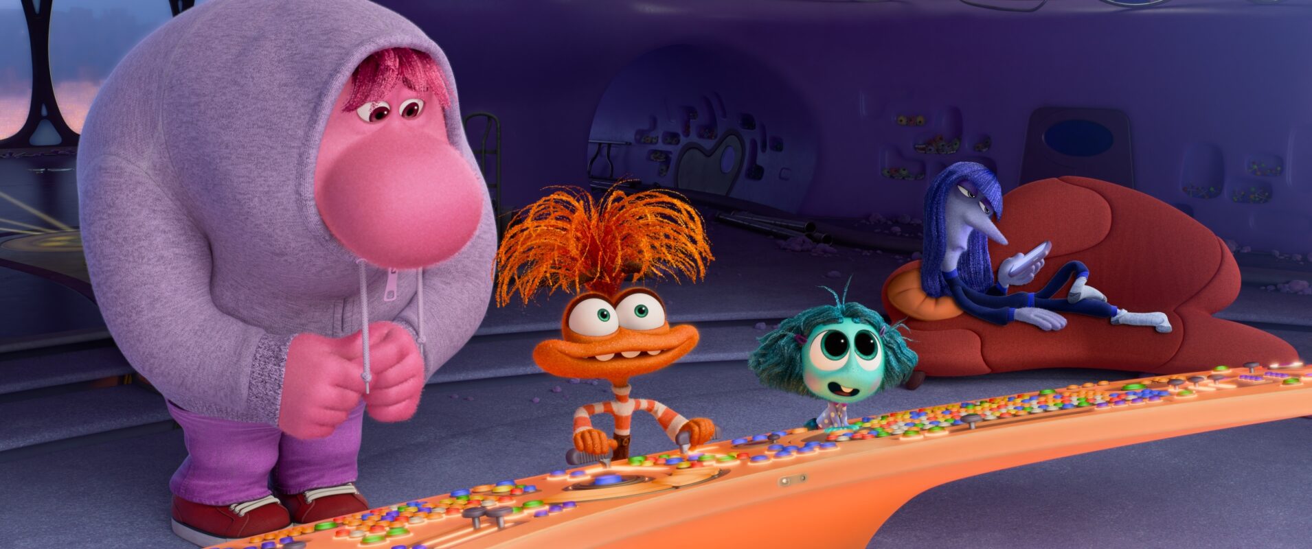 A large pink character in a hoodie stands beside an orange character with fuzzy hair, a green character, and a blue character resting on a couch, all in a colorful, futuristic room.