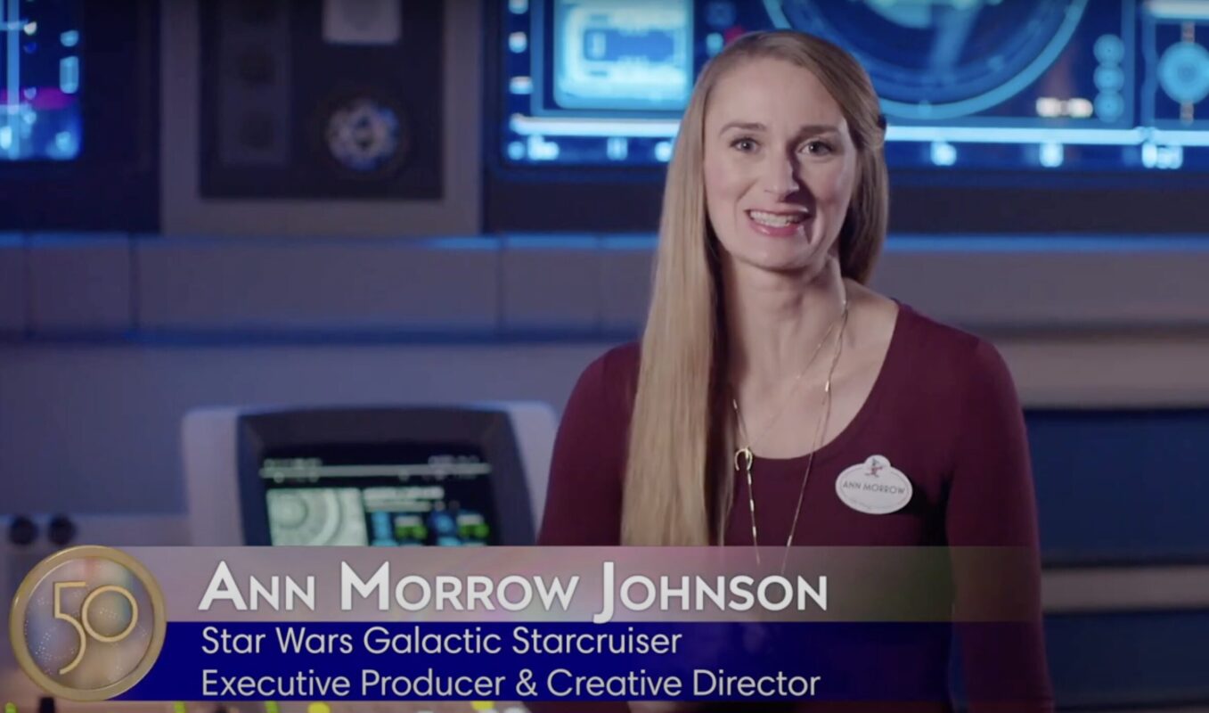 A woman standing in front of a futuristic background wearing a name tag that reads "Ann Morrow Johnson." The text on the image identifies her as the Executive Producer & Creative Director for Star Wars Galactic Starcruiser.