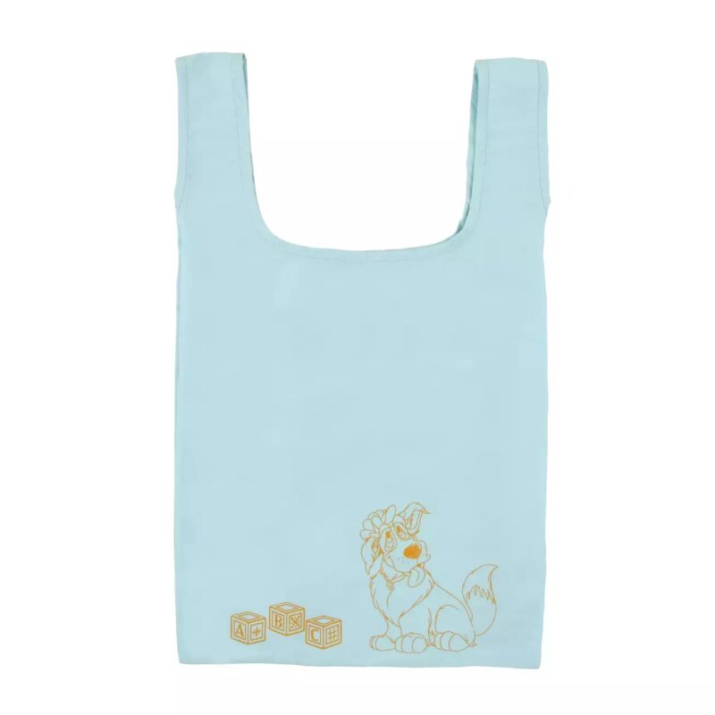 A light blue fabric bag with handles. It features a printed design of a cat with a bow tie and three alphabet blocks labeled A, B, and C.