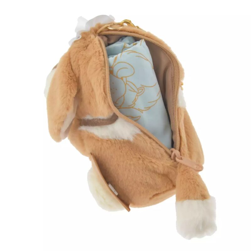 A plush bunny-shaped bag with an open zipper showing a blue item inside. The bag is light brown with white accents on the ears, paws, and tail.