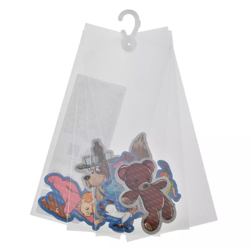A set of colorful animal and character-themed felt pieces is displayed inside a transparent plastic hanging organizer.