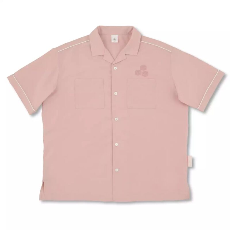 A light pink short-sleeved button-up shirt with white piping accents, featuring two chest pockets and an embroidered design on the left side.