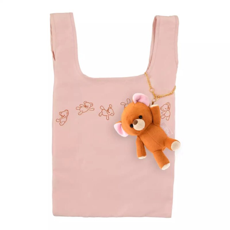 A pastel pink reusable tote bag features a pattern of small teddy bear illustrations and a plush teddy bear keychain attached.