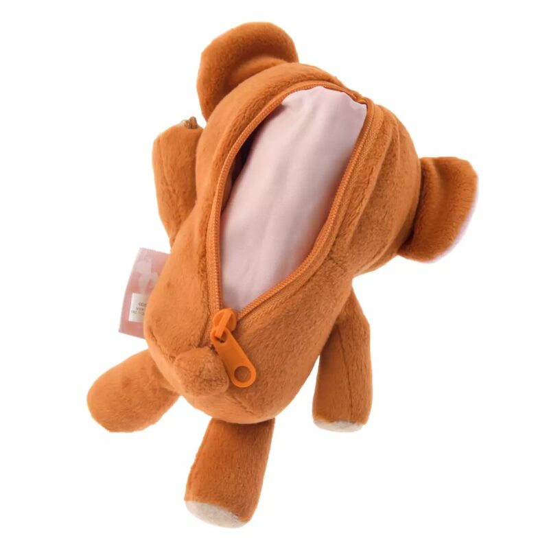 A brown bear-shaped plush toy with an orange zipper on its back, revealing a light pink lining inside. The toy is shown lying face down.