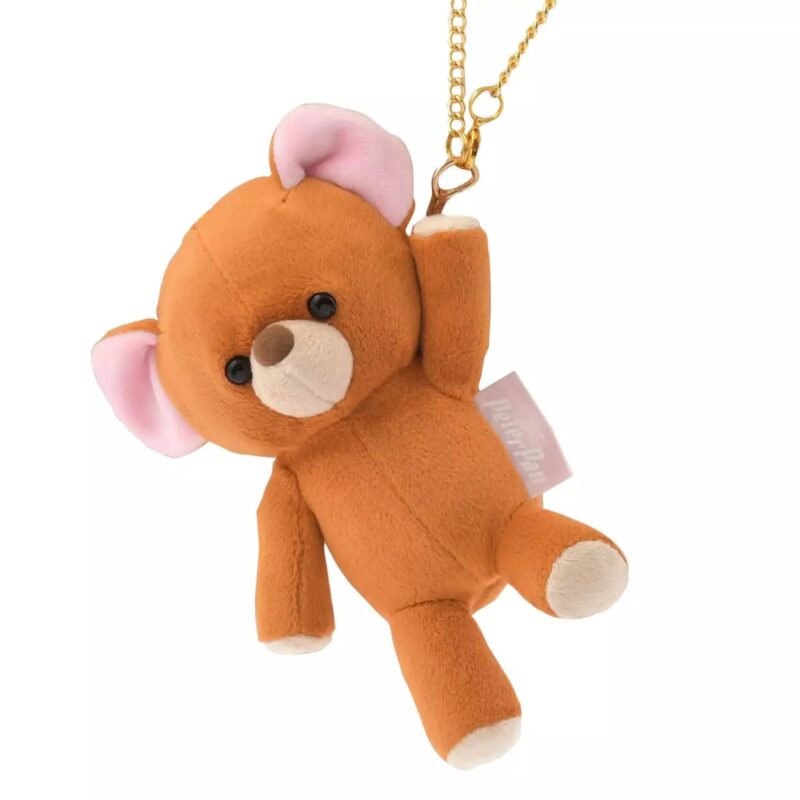 A small brown stuffed bear keychain with pink ears and a gold chain attachment.