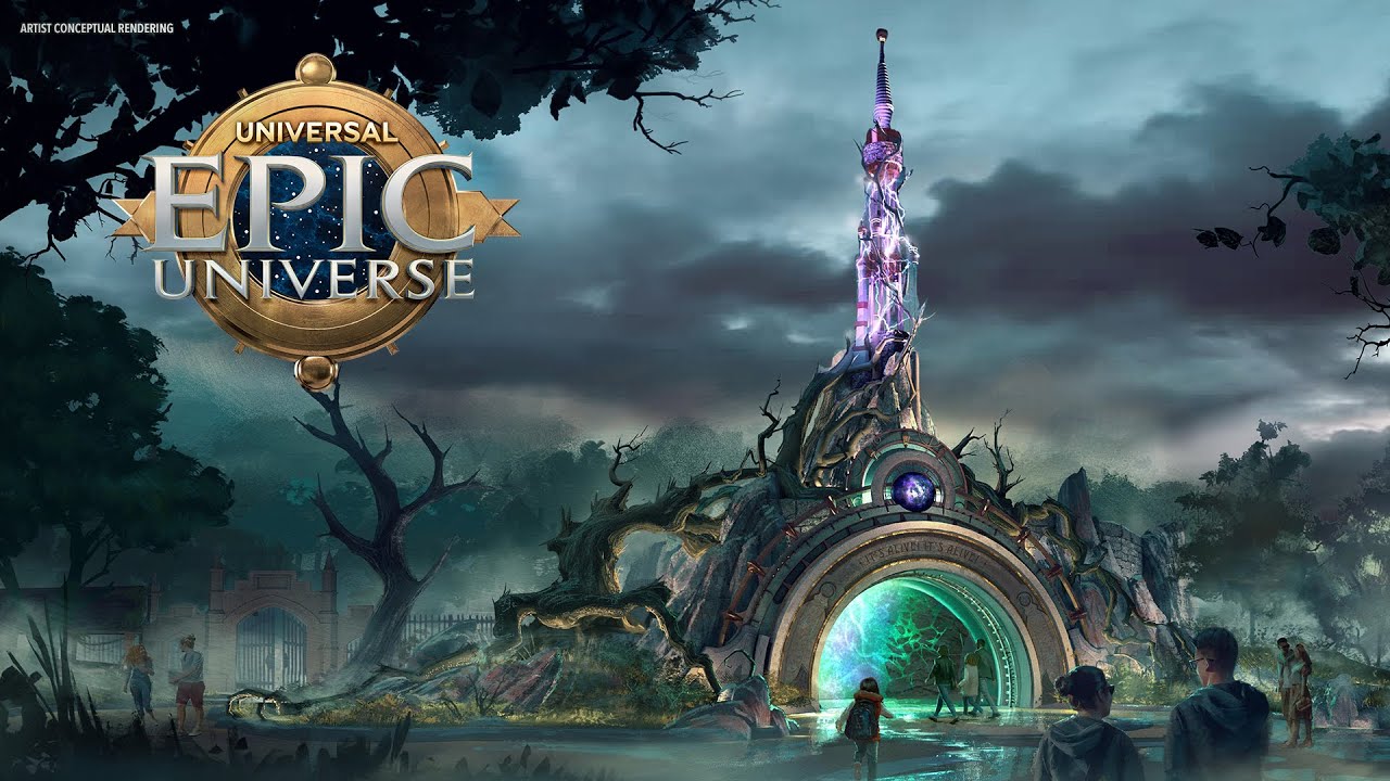 Concept art of Universal's Epic Universe theme park reveals an elaborate entrance with a towering structure and lush greenery, leading to a glowing portal under a cloudy sky. The scene hints at a dark universe, as visitors approach the mysterious gateway.