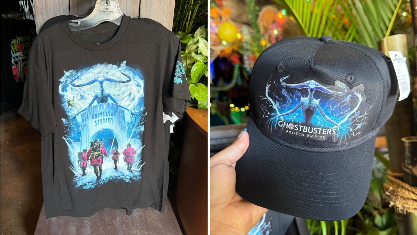 A black T-shirt and baseball cap featuring designs from Universal Studios and Ghostbusters: Frozen Empire. The shirt shows the Ghostbusters team in front of an arched entrance, while the cap has a whale tail and lightning motif.