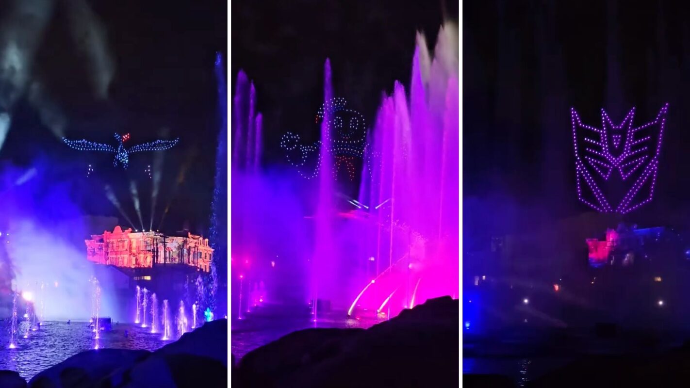 A nighttime show with illuminated water fountains and drones forming images of a bird, an Autobot, and a Decepticon in the sky.