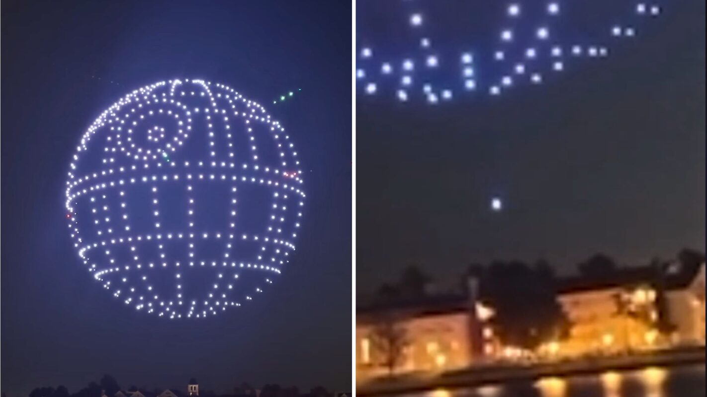 A night sky with numerous small lights forming the shape of a large, round, sci-fi spaceship, reminiscent of the Death Star, above silhouetted buildings.