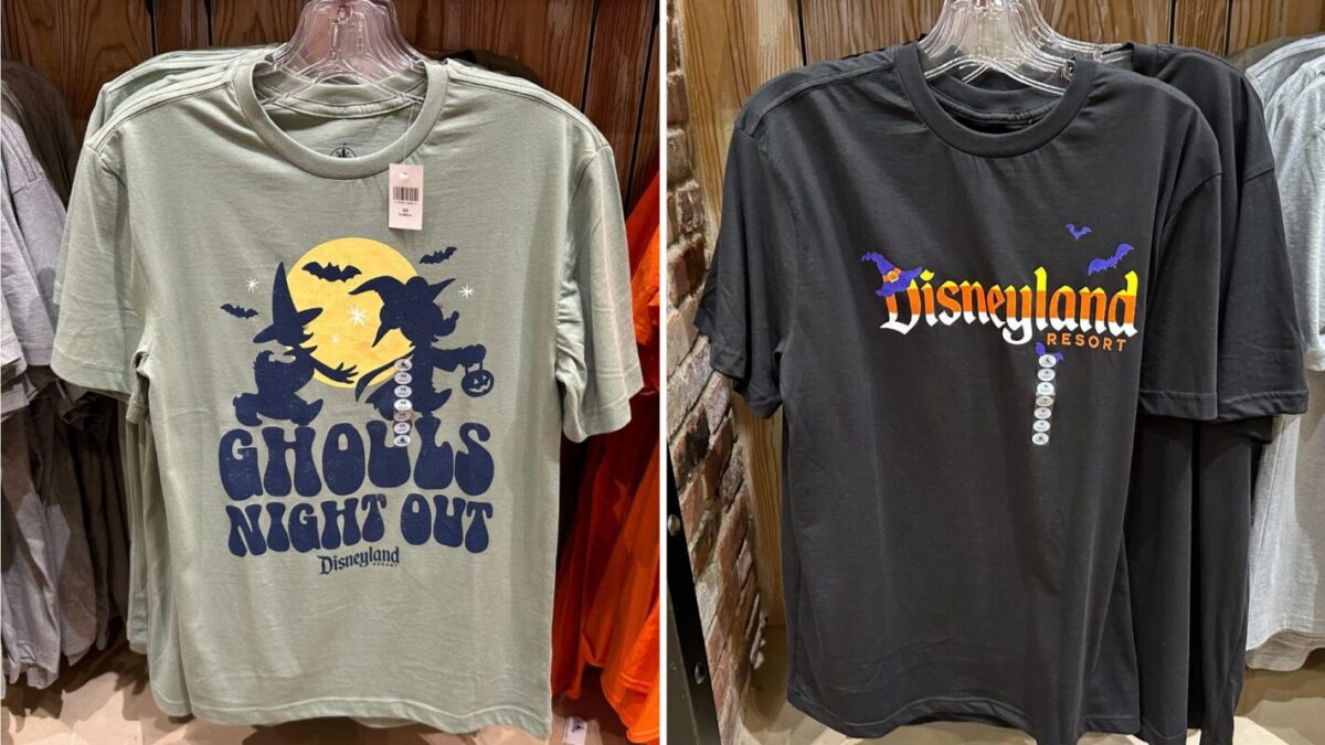 Two Disneyland T-shirts on display: one green with "Ghouls Night Out" featuring Halloween graphics, and one black with a colorful Disneyland Resort logo.