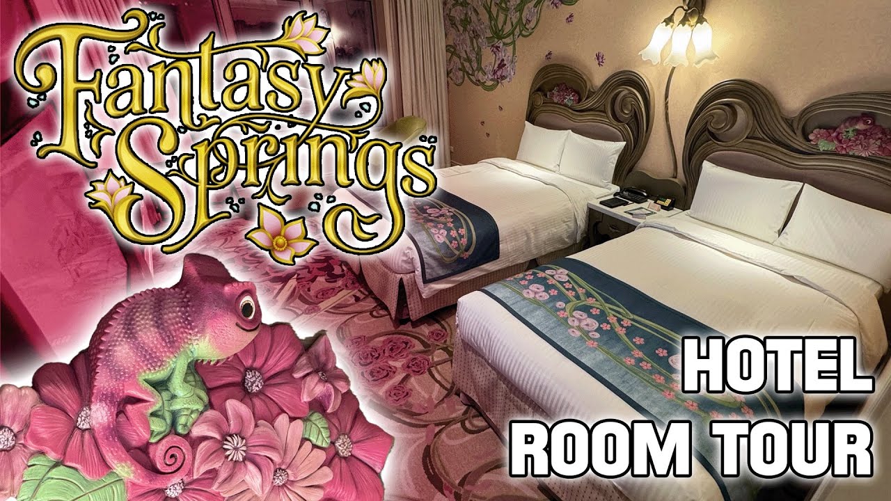 A hotel room with two queen beds, floral-themed bedding and carpet, ornate headboards, and wall decorations. Text reads "Fantasy Springs Hotel Room Tour" with an illustrated creature among flowers.