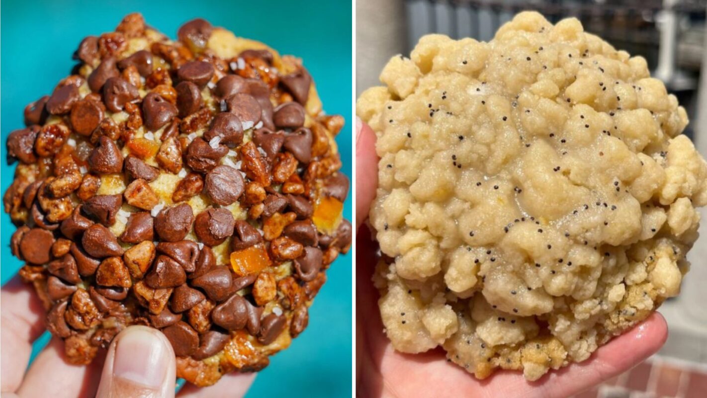 A side-by-side image of two different cookies being held. The cookie on the left is covered in chocolate chips and small chunks of orange, while the cookie on the right has a crumbly texture with poppy seeds.
