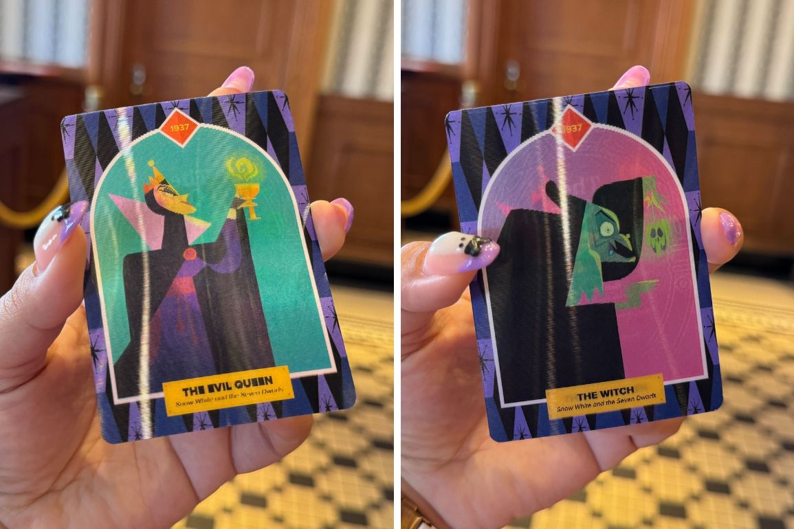 Two trading cards are displayed side by side: one, an Evil Queen Trading Card, depicts her holding a potion; the other shows The Witch pointing with a sinister expression, both from the same Disney story.