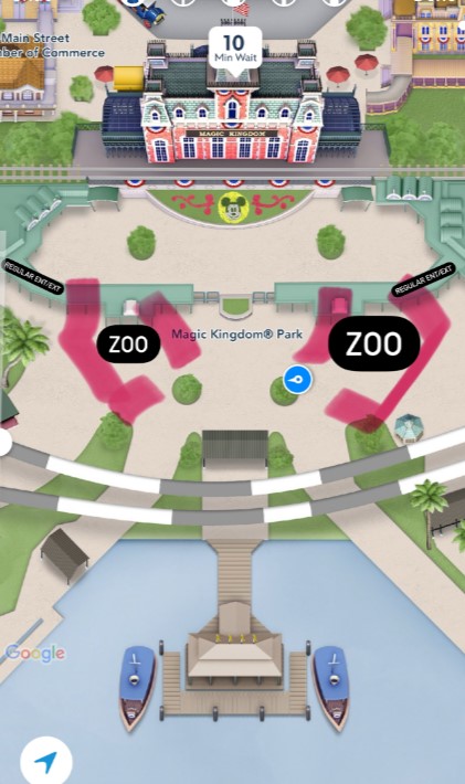 Top-down view of a map at Magic Kingdom® Park highlighting two zoo locations with pink markers and a 10-minute wait indicator near the top. The map also shows various buildings, paths, and boats.
