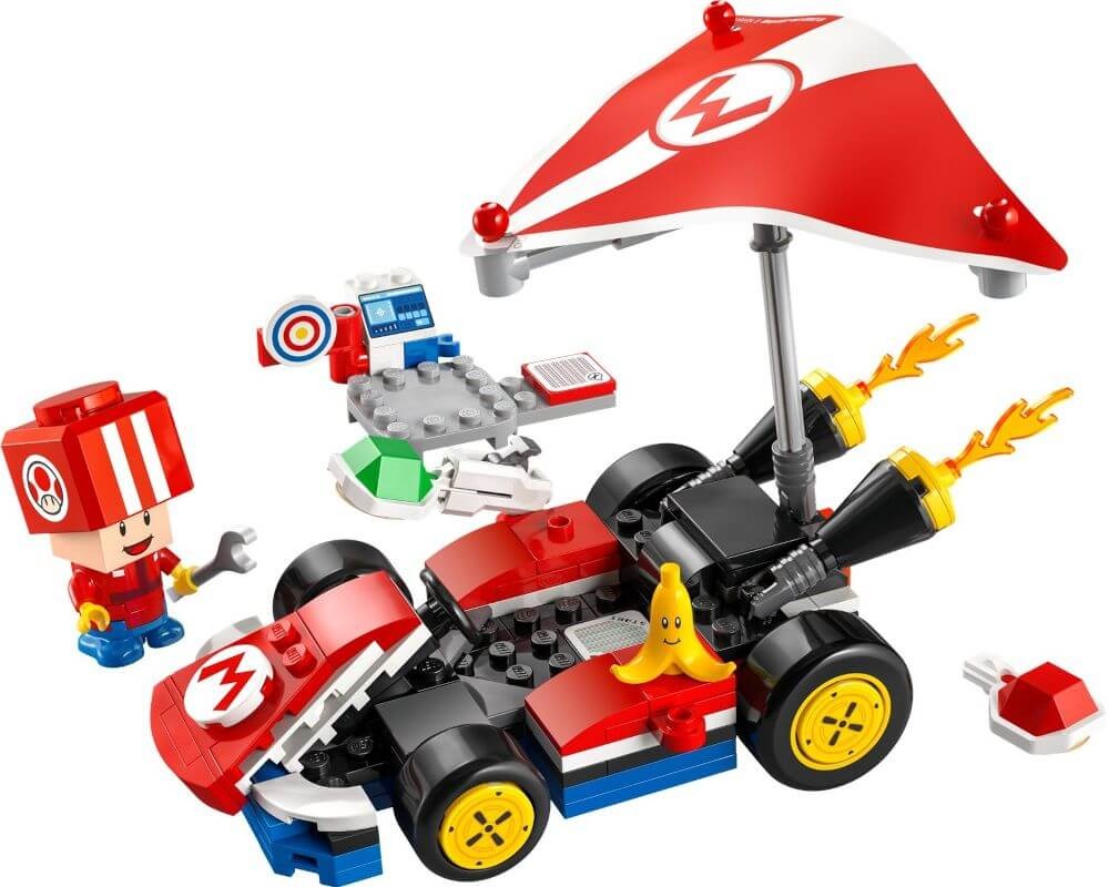 Colorful LEGO Super Mario-themed kart set with a character figure, red and white umbrella, banana piece, and various accessories on a white background.