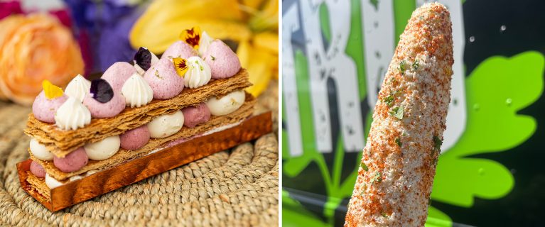 A pastry with layers of cream and garnishes sits on the left, while an elote with toppings is featured on the right, celebrating Hispanic and Latin American Heritage Month at Disneyland.