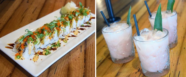 A sushi roll on a rectangular white plate garnished with sauce and greens sits next to three iced cocktails with straws and mint leaves, creating a delightful scene of food and beverages that would be right at home in Disneyland.