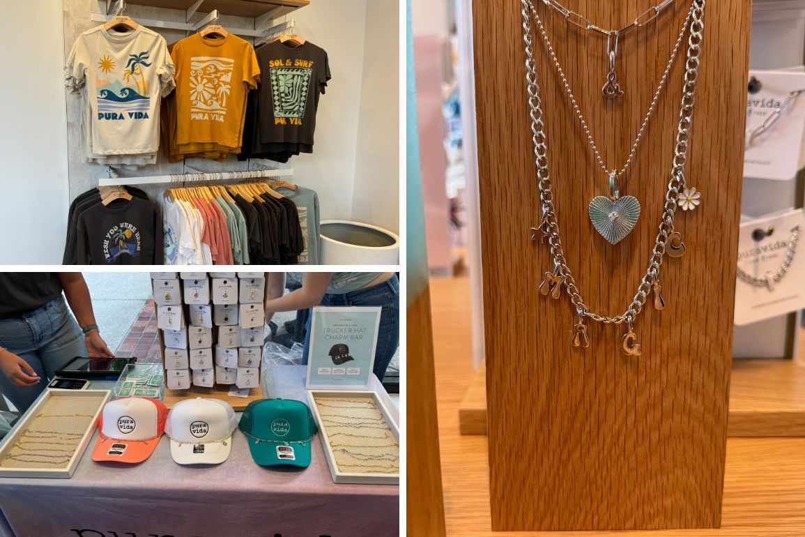 In the new store at Disney Springs, a display of stacked T-shirts stands on the left, while Pura Vida's variety of necklaces with pendants adorns the right. Hats and bracelets are artfully laid out on a table in the bottom left corner.
