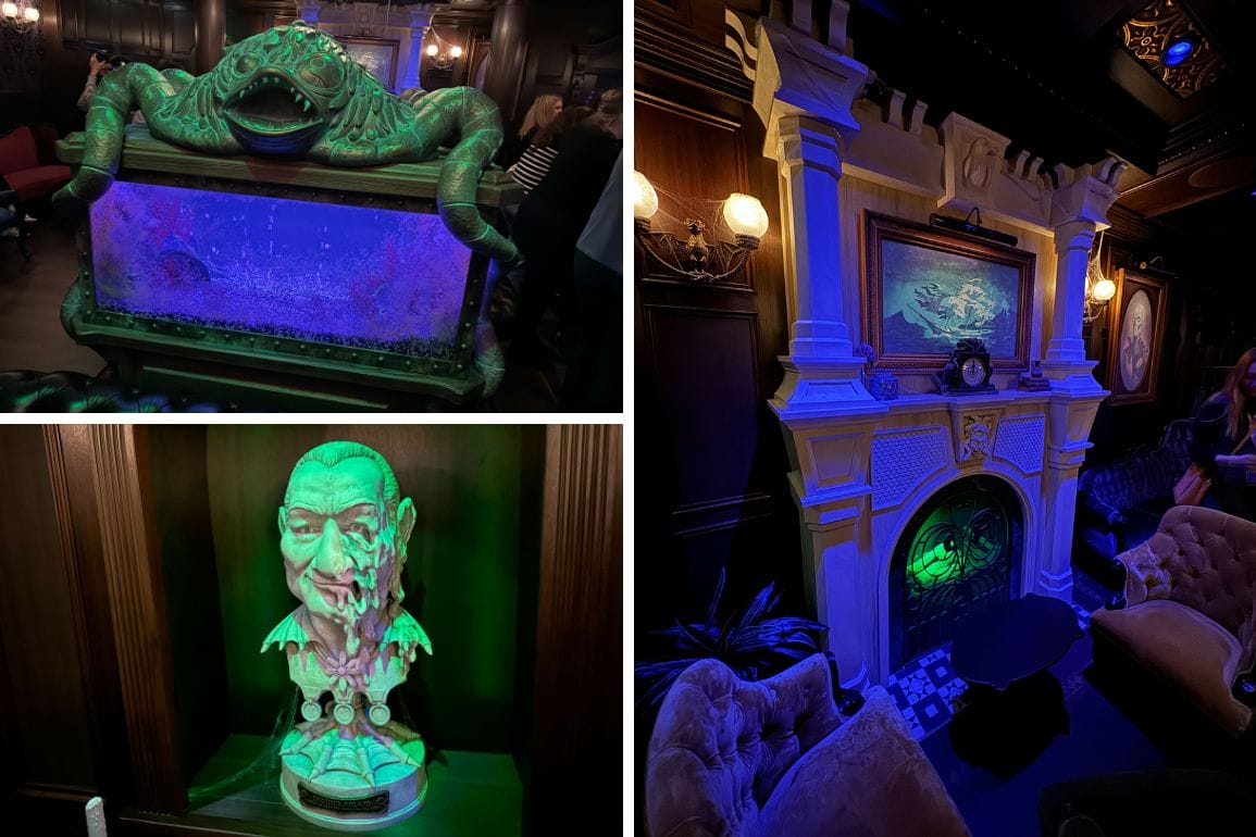 A room with a vintage fireplace and armchairs, an ornate aquarium with a frog design, and a bust sculpture with green lighting.