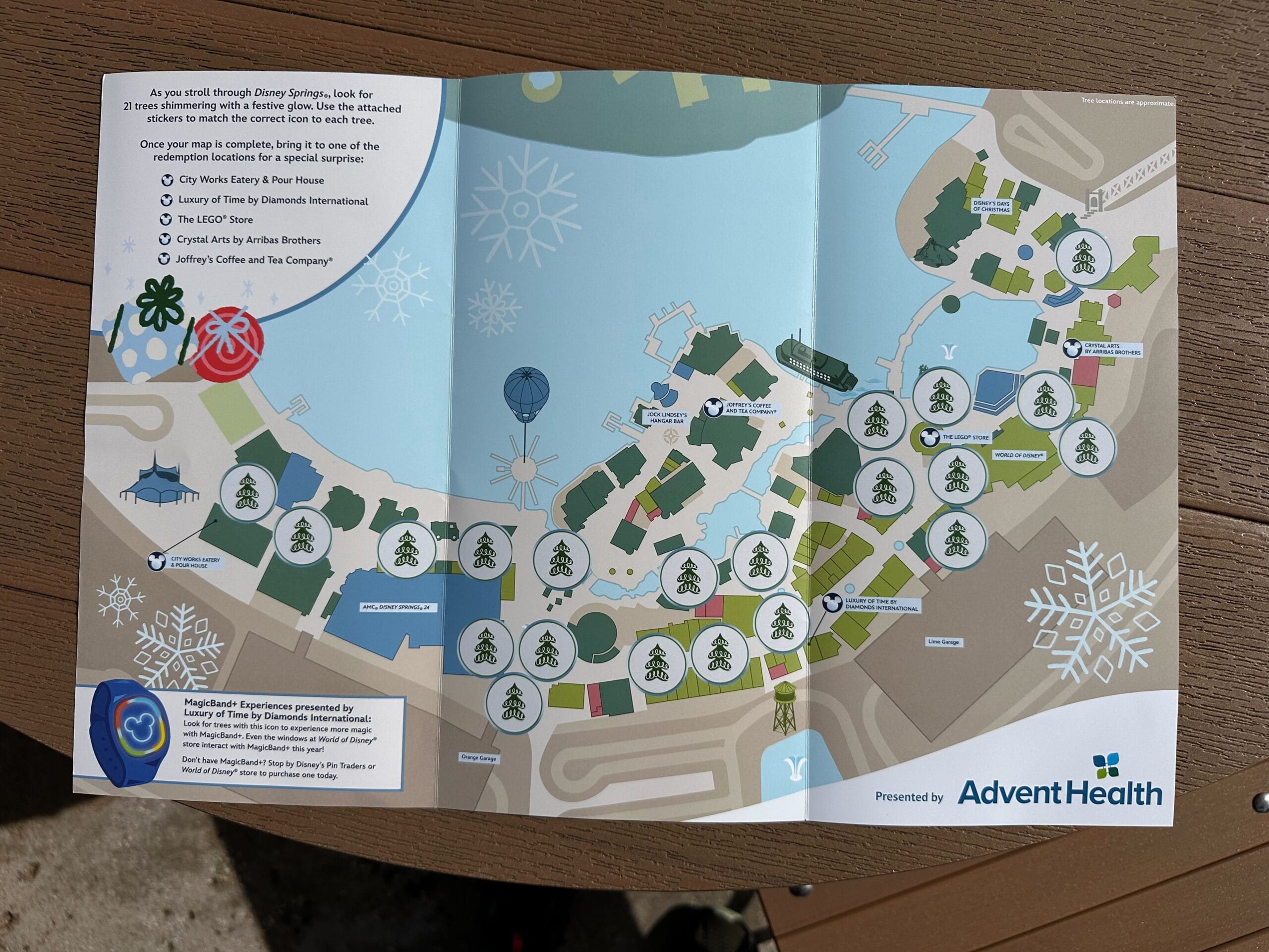 Explore the Disney Springs Christmas Tree Stroll with a detailed map featuring various tree locations marked with icons. Presented by Advent Health, this guide ensures a magical holiday experience as you wander through a winter wonderland adorned in festive cheer.