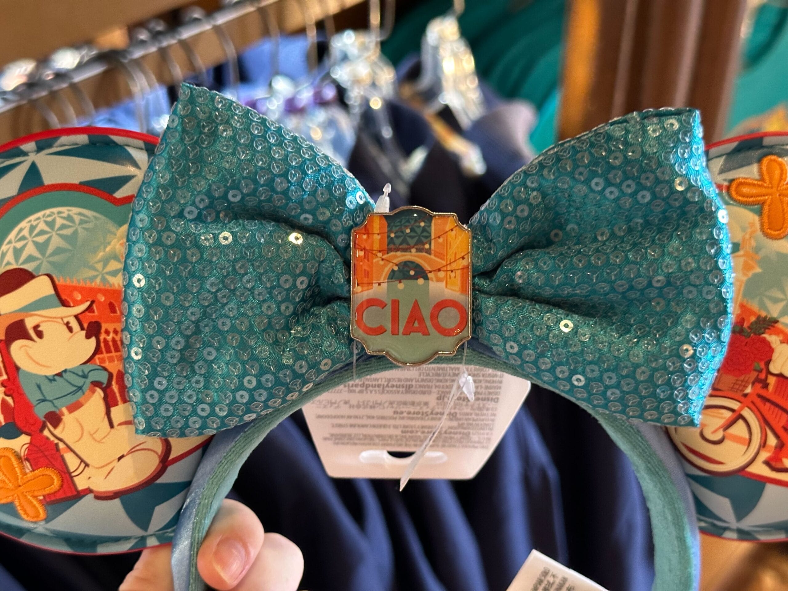 Mickey Mouse-themed ears with a turquoise bow and "CIAO" pin, featuring Mickey in a hat and sunglasses.