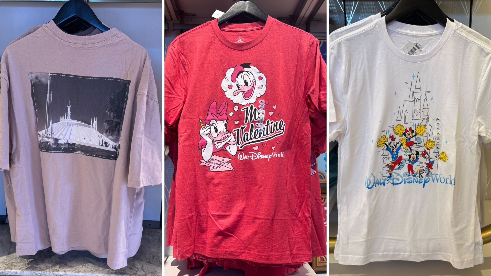 Three Disney-themed t-shirts hang on a rack: a beige one with a Space Mountain print, a red one featuring Minnie and Mickey with "The Valentine," and a white one with classic Disney characters.