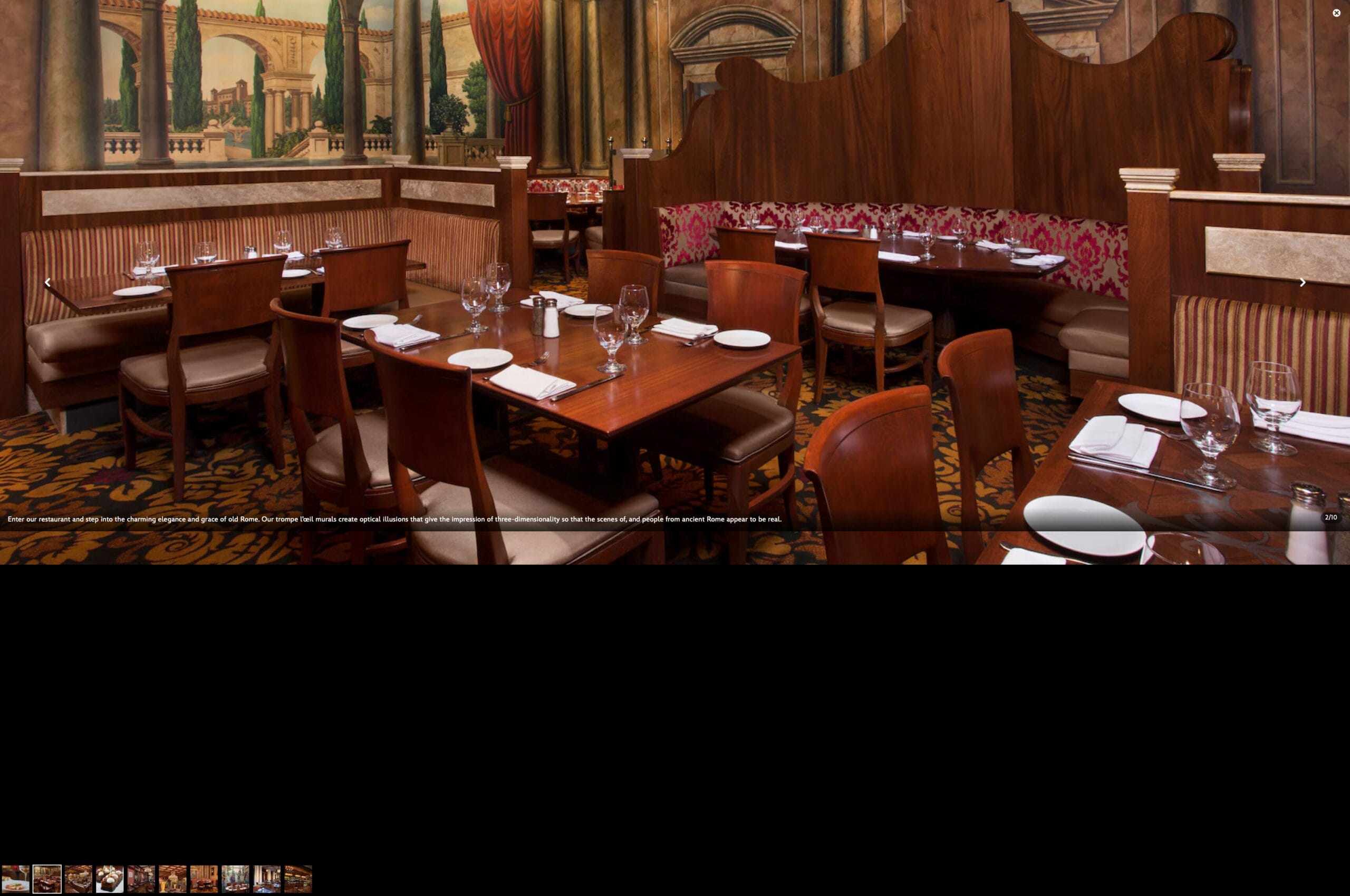 Elegant Italian restaurant with wooden tables, red chairs, set with glassware and plates at Epcot’s Tutto Italia Ristorante.