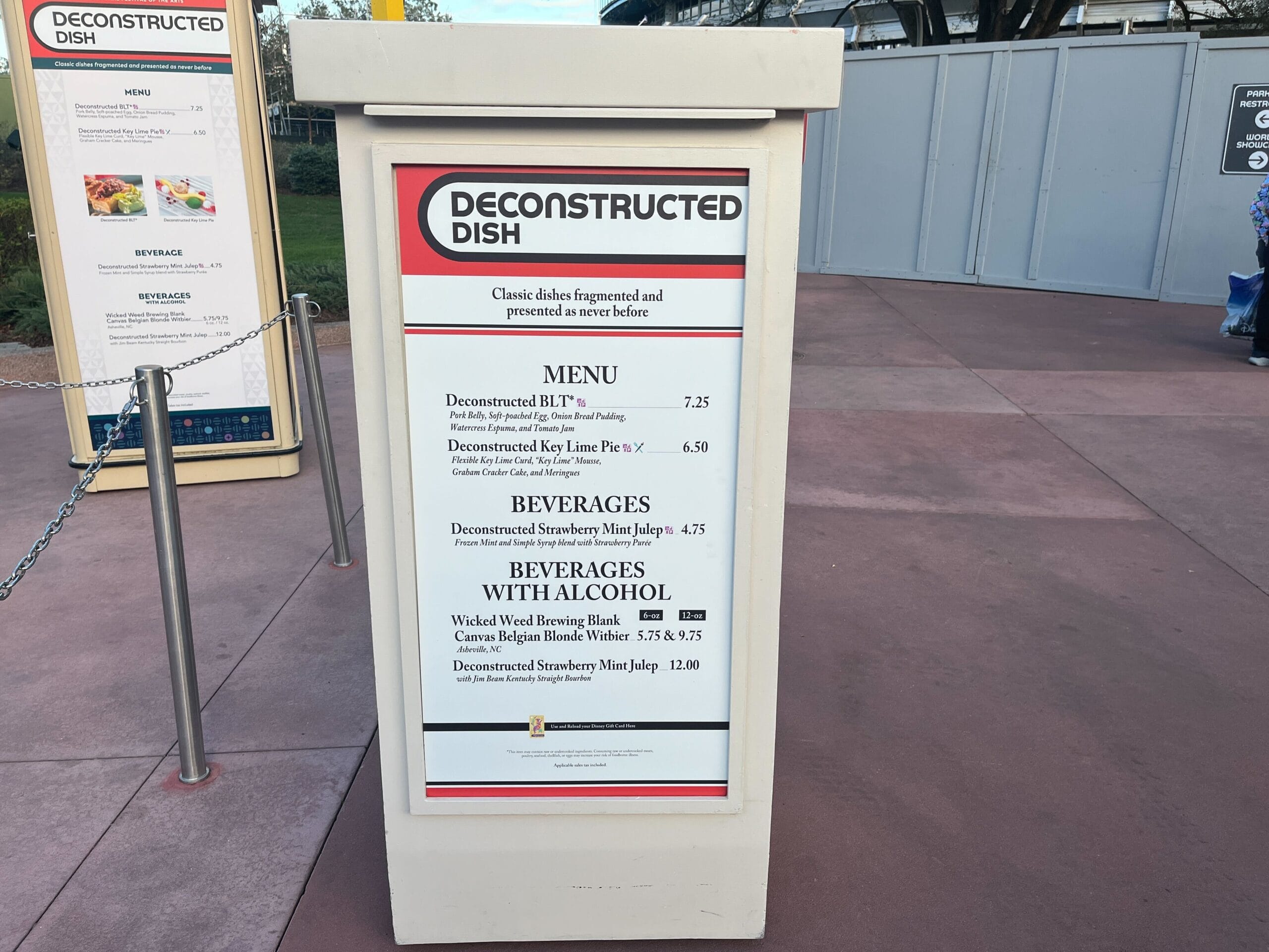 Menu board titled "Deconstructed Dish" for the Festival of the Arts, featuring culinary masterpieces like BLT, Key Lime Pie, Strawberry Mascarpone Cake, and creative beverages such as Berry Blonde Ale.