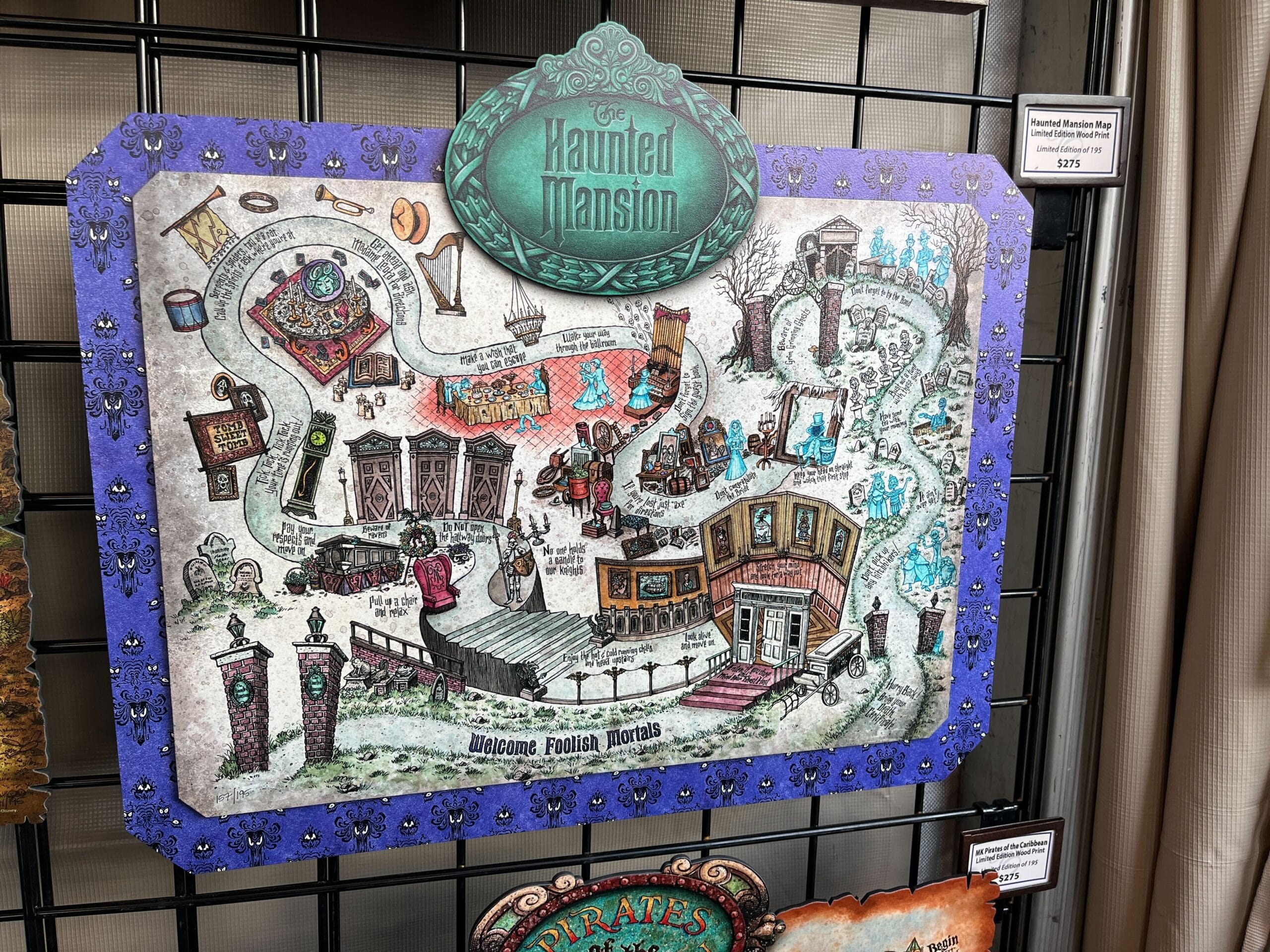 Illustrated map of "The Haunted Mansion" attraction, crafted by Dave Avazano for the 2025 EPCOT Festival of the Arts, featuring a winding path and scenes with ghosts, carriages, and eerie buildings on a black grid backdrop.