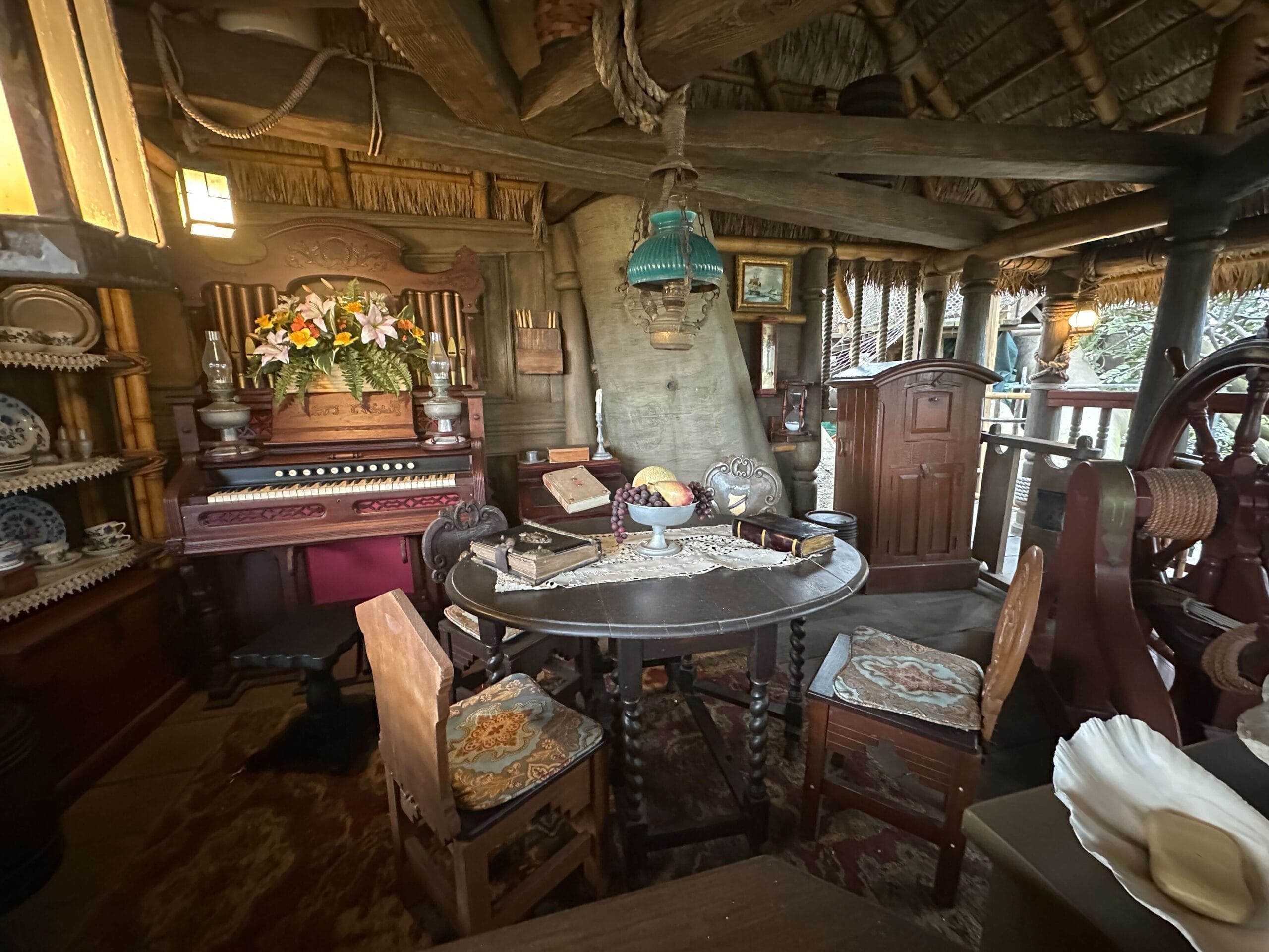 Cozy, rustic room with antique furniture and vintage decor, inspired by the Swiss Family Treehouse in Adventureland.