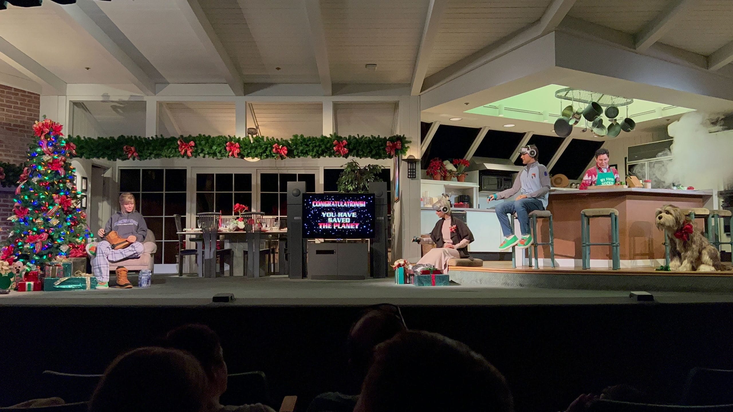 A holiday-themed stage play inspired by Walt Disney’s Carousel of Progress, set in a festive living room and kitchen.