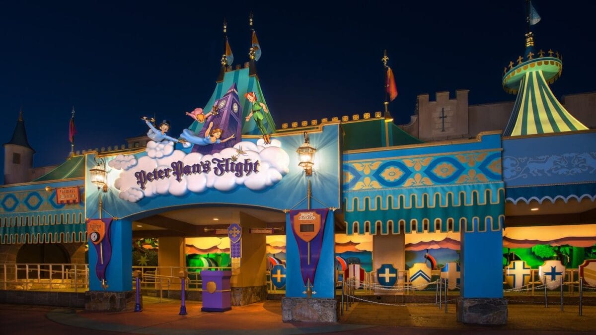 Colorful entrance to Peter Pan’s Flight in Fantasyland, with whimsical decorations and animated characters flying above.