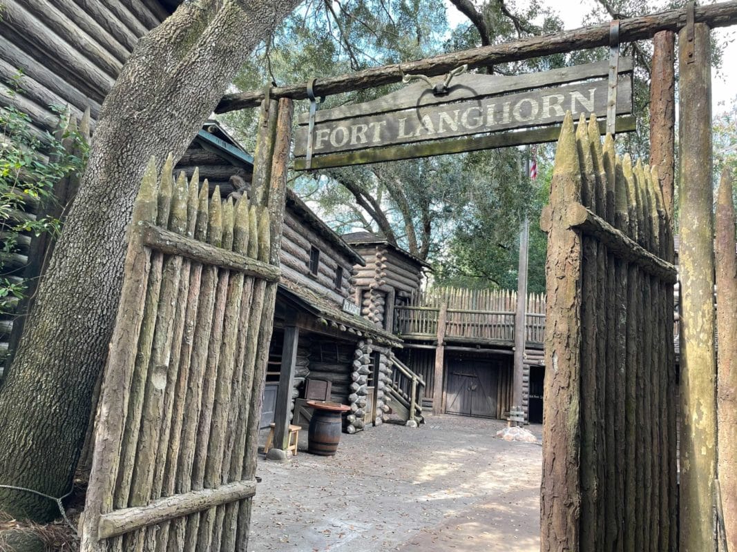 Wooden gates open to reveal Fort Langhorn, an adventure hideaway on Tom Sawyer Island at Disneyland.