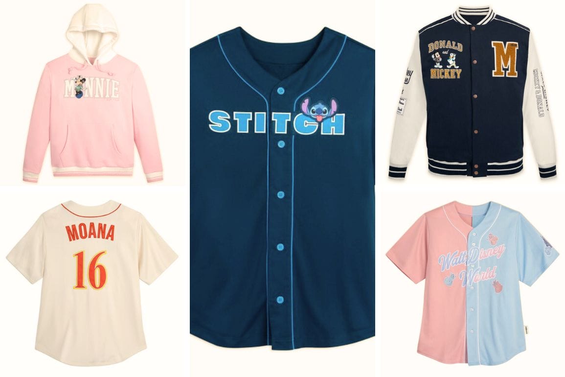 A variety of Disney-themed clothing items are on display, including a pink hoodie, a navy Stitch jersey, varsity jackets with collegiate flair, a Moana sports jersey, and stylish baseball-style jerseys in pink and blue.