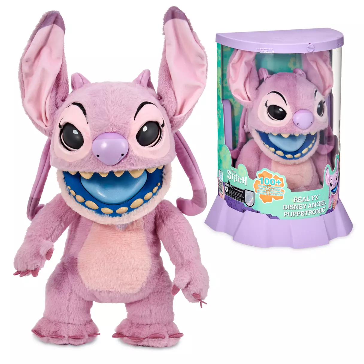 A plush toy resembling a pink alien with large ears, prominent eyes, and a wide smile, next to its original Disney Store packaging.