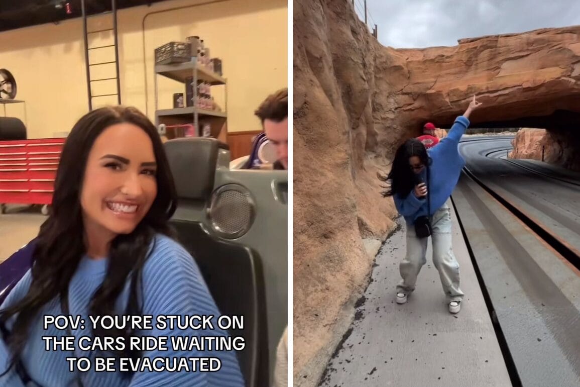 A person in a blue sweater sits in a ride vehicle, pointing outside near a rocky tunnel. Overlay text reads: "POV: You're stuck on the Cars ride waiting to be evacuated with Demi Lovato tunes playing softly.